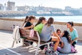 A group of Spanish, female teenagers meet after school to talk t