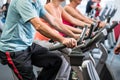 Group spinning at the gym on fitness bikes Royalty Free Stock Photo