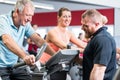 Group spinning with personal trainer in gym Royalty Free Stock Photo