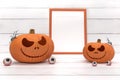 Group spooky halloween pumpkin, Jack O Lantern, with an evil face and eyes , ghost spider, photo frame and eyeball on a white wood Royalty Free Stock Photo