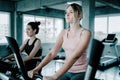 Group of Sport Women Bike Exercising in Fitness Club, Sporty Women in Sportswear Workout Exercised on Cycling Machine. Portrait of Royalty Free Stock Photo