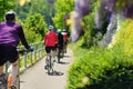 Group of Sportive man cycling in sunny park in hot summer day. Switzerland, Europe