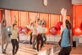 Group of sportive of teenage girls exercising in the gym. Children healthy lifestyle concept.