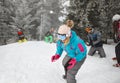 Group sportspeople on mountain making snowballs