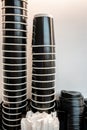 Group of Stack coffee black paper cup, space to put logo, life cafe background