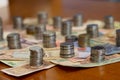 Group of stack currency coins and notes on table - Image Royalty Free Stock Photo