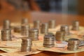 Group of stack currency coins and notes on table - Image Royalty Free Stock Photo