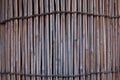 Stack wall of bamboo tubes wooden background