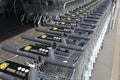 Group of stacked metal supermarket trolleys