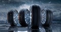 Group of standing car wheels with tire in the rain Royalty Free Stock Photo