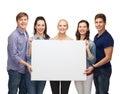 Group of standing students with blank white board