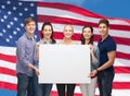 Group of standing students with blank white board Royalty Free Stock Photo
