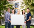 Group of standing students with blank white board Royalty Free Stock Photo