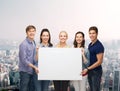 Group of standing students with blank white board Royalty Free Stock Photo