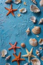 A group of starfish and shells on a blue surface. Perfect for beach and marine themed designs Royalty Free Stock Photo