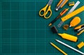 Group of stationery supplies on cutting mat, flat lay picture. Royalty Free Stock Photo