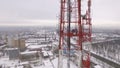 Group of steeplejacks are working on a high of telecommunication tower, aerial view