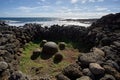 Group of stones collected in a circle and the sea on the background Royalty Free Stock Photo