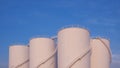 Group of Storage Fuel Tanks in Oil Industrial area against blue sky background in widescreen view Royalty Free Stock Photo