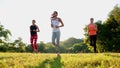 Group stretching workout, large group stretches outdoor on a green grass in park