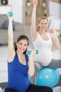 group strong pregnant woman in yoga poses