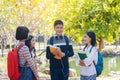 Group of student happy young people walking outdoors, Diverse Young Students Book Outdoors Concept Royalty Free Stock Photo