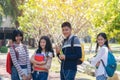 Group of student happy young people walking outdoors, Diverse Young Students Book Outdoors Concept Royalty Free Stock Photo