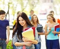 Group student with notebook on bench outdoor. Royalty Free Stock Photo