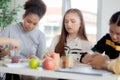Group of student sitting and studying and learning drawing with teacher together in classroom at the school. Royalty Free Stock Photo