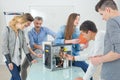 Group students around dismantled computer Royalty Free Stock Photo