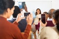 Group of students attentively listening to lecture of female teacher Royalty Free Stock Photo