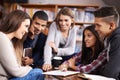 Group, students or brainstorming for project in library or diversity for knowledge in university. Friends, learning or Royalty Free Stock Photo