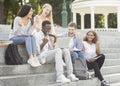 Group of students celebrating success, checking exam results online Royalty Free Stock Photo