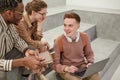 Group of Students Chatting in College Royalty Free Stock Photo