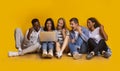 Group of students checking exam results online over yellow background Royalty Free Stock Photo