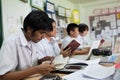 A group of students in a classroom working together on an exercise