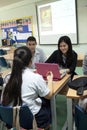 A group of students in a classroom working together on an exercise