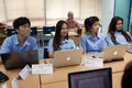 A group of students in a classroom working together on an exercise