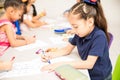 Group of students coloring in class Royalty Free Stock Photo