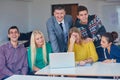 Group of students getting suppport from teacher Royalty Free Stock Photo