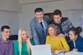 Group of students getting suppport from teacher Royalty Free Stock Photo