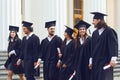 Group of students graduates go against the university college.