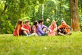 group of students with a guitar resting in the Park Royalty Free Stock Photo