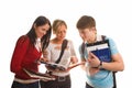 Group of students having fun, doing home work (iso Royalty Free Stock Photo