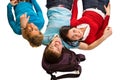 Group of students having fun, laying on white Royalty Free Stock Photo