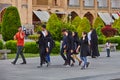Group of students having fun talking on walk, Isfahan, Iran.