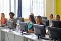 Group of students at an informatics lecture. Smart young people study at the college. Education, college, university, learning and Royalty Free Stock Photo