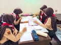 A group of students are learning to recognize and translate the Javanese script in class. Royalty Free Stock Photo