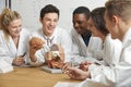 Group Of Students Looking At Model Brain In Biology Class Royalty Free Stock Photo