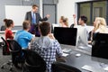 Group Of Students With Male Tutor In Computer Class Royalty Free Stock Photo
